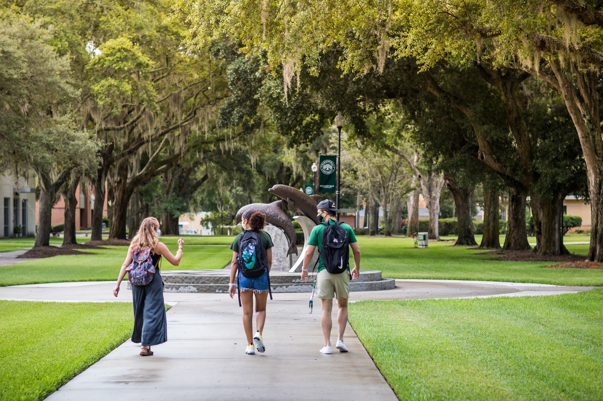 Three JU students walking